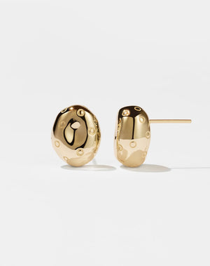 A pair of small, gold-plated earrings designed in the shape of abstract strawberries with seeds