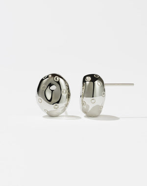 A pair of sterling silver earrings designed in an abstract strawberry shape with leaves on the top, presented against a white background.