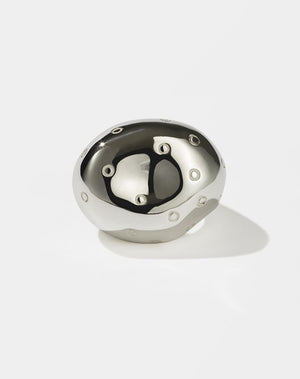 A sterling silver ring with an abstract design resembling a strawberry with multiple seeds.