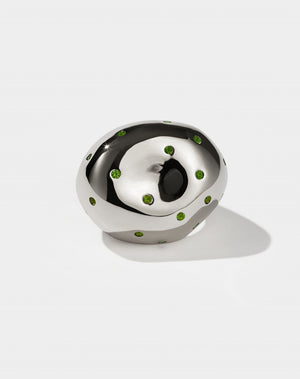 A sterling silver ring with abstract strawberry design, set with green gemstones in Swiss settings.