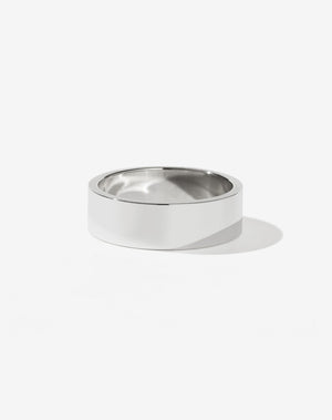 A simple, classic wide band sterling silver ring.