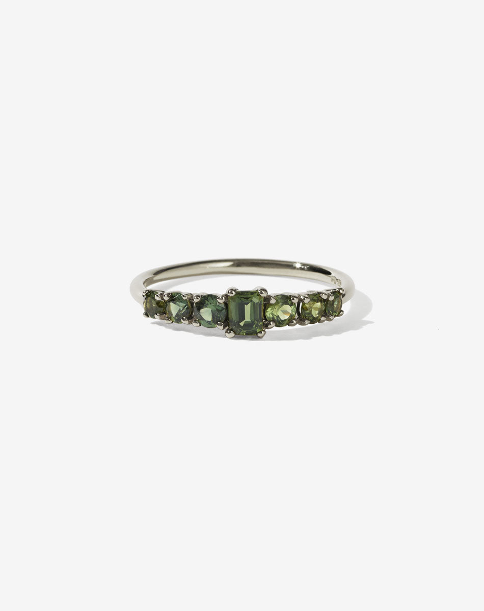 This beautiful and petite seven stone ring has a central emerald cut stone and is flanked by three ascending sized round brilliant diamonds on each shoulder.</p>