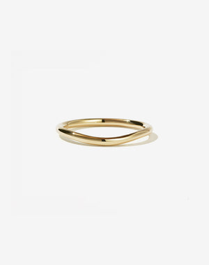 A simple, elegant plain band ring in yellow gold, designed to fit a favorite ring.