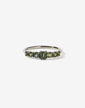 Meadowlark Jewellery’s beautiful Amelie Engagement Ring in 14ct White Gold, claw set with emerald cut and round brilliant cut green sapphires atop a fine round band. Fully traceable and ethically sourced blue and green sapphires from Queensland, Australia. A low set, petite seven stone engagement ring this Ceremonial design made to order in New Zealand.