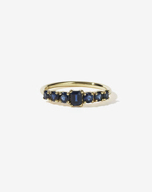 Meadowlark Jewellery’s beautiful Amelie Engagement Ring in 14ct Yellow Gold, claw set with emerald cut and round brilliant cut blue sapphires atop a fine round band. Fully traceable and ethically sourced blue and green sapphires from Queensland, Australia. A low set, petite seven stone engagement ring this Ceremonial design made to order in New Zealand.