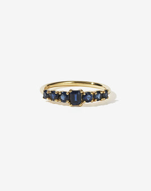 Meadowlark Jewellery’s beautiful Amelie Engagement Ring in 18ct Yellow Gold, claw set with emerald cut and round brilliant cut blue sapphires atop a fine round band. Fully traceable and ethically sourced blue and green sapphires from Queensland, Australia. A low set, petite seven stone engagement ring this Ceremonial design made to order in New Zealand.