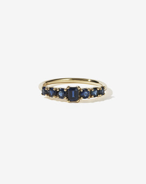 Meadowlark Jewellery’s beautiful Amelie Engagement Ring in 9ct Yellow Gold, claw set with emerald cut and round brilliant cut blue sapphires atop a fine round band. Fully traceable and ethically sourced blue and green sapphires from Queensland, Australia. A low set, petite seven stone engagement ring this Ceremonial design made to order in New Zealand.