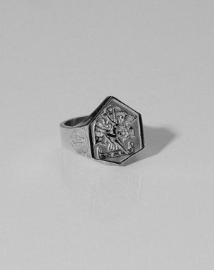 A heavy weighted sterling silver ring with a collage of artworks, designed in collaboration with NZ artist Andrew McLeod.