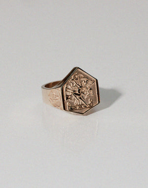 A heavy weighted gold ring with a collage of artworks, designed in collaboration with NZ artist Andrew McLeod.