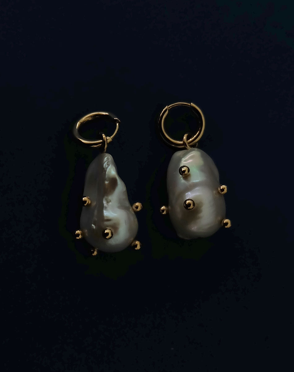 Baroque pearl earrings with small balls dotted all over.