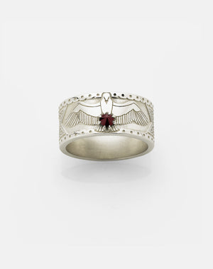 A 9ct white gold band ring with a detailed eagle clasping a round brilliant stone, featuring a Russian orthodox cross and skull etching around the band.