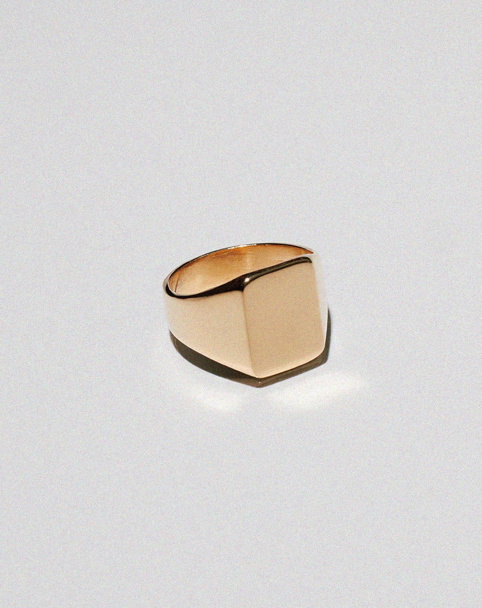 Gold signet ring with a large rectangular shape