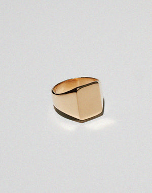 Gold signet ring with a large rectangular shape
