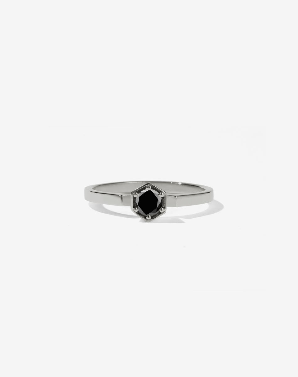 Meadowlark Jewellery’s classic Hexagon Solitaire Engagement Ring in Platinum, claw set with a 0.25ct round brilliant cut white diamond atop a fine square band. A minimalist, yet bold Ceremonial design made to order in New Zealand.