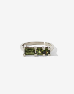 Meadowlark Jewellery’s architecture inspired 1.1ct Hilma Engagement Ring in 9ct White Gold, claw set with a round brilliant cut, princess cut and baguette cut green sapphire. Atop a fine square band. Fully traceable and ethically sourced blue and green sapphires from Queensland, Australia. A bold and alternative Ceremonial design made to order in New Zealand. Pair with our modern Stella Ring.