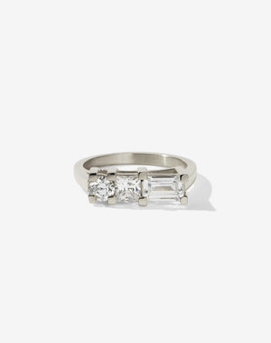 Meadowlark Jewellery’s architecture inspired 1.1ct Hilma Engagement Ring in 9ct White Gold, claw set with a round brilliant cut, princess cut and baguette cut white diamond. Atop a fine square band. A bold and alternative Ceremonial design made to order in New Zealand. Pair with our modern Stella Ring.