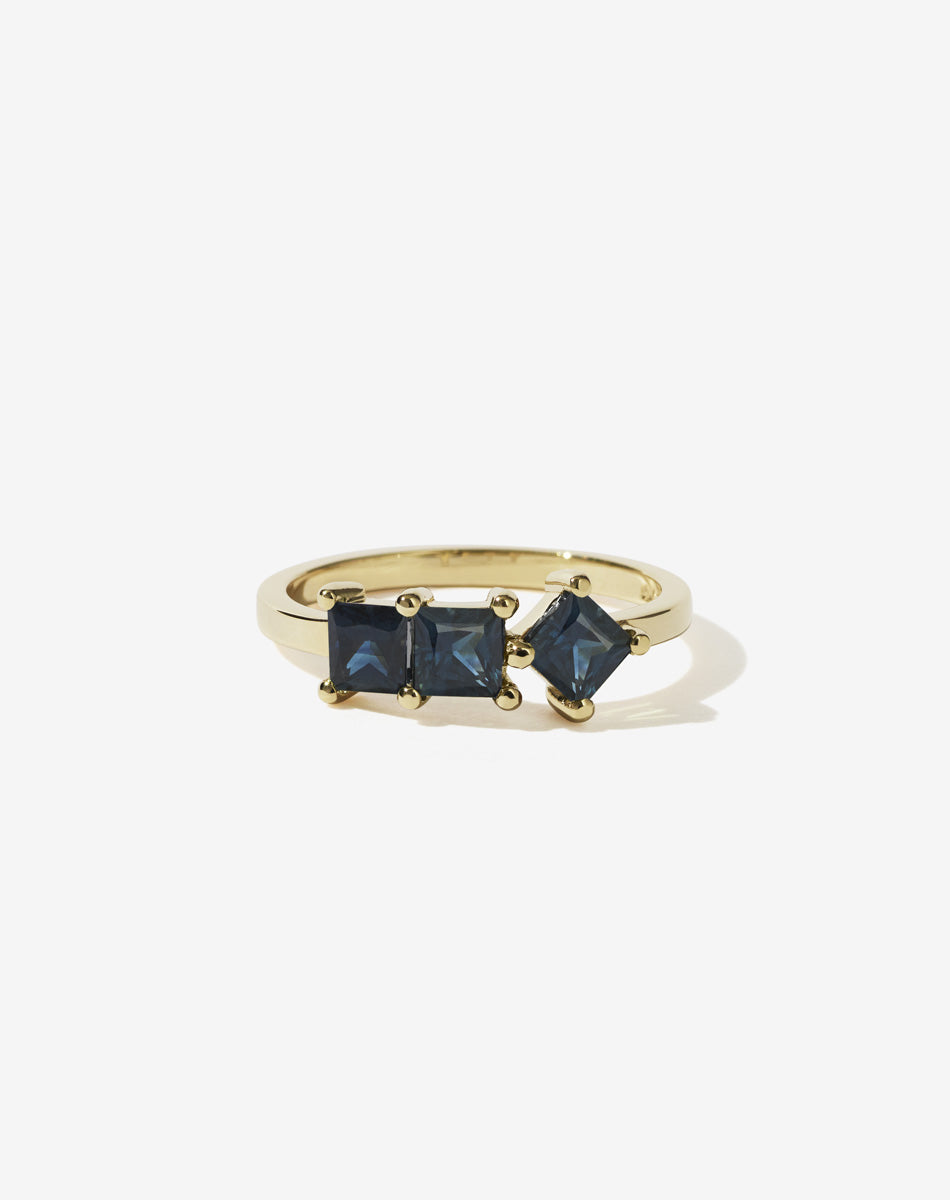 Meadowlark Jewellery’s modern 1.20ct Imogen Engagement Ring in 14ct Yellow Gold, claw set with three princess cut white diamonds. Atop a fine square band. A graphic 3 stone engagement ring, inspired by art and architecture, this Ceremonial design is made to order in New Zealand.