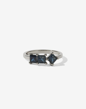 Meadowlark Jewellery’s modern Imogen Engagement Ring in 18ct White Gold, claw set with three princess cut blue sapphires. Atop a fine square band. Fully traceable and ethically sourced blue and green sapphires from Queensland, Australia. A graphic 3 stone engagement ring, inspired by art and architecture, this Ceremonial design is made to order in New Zealand.
