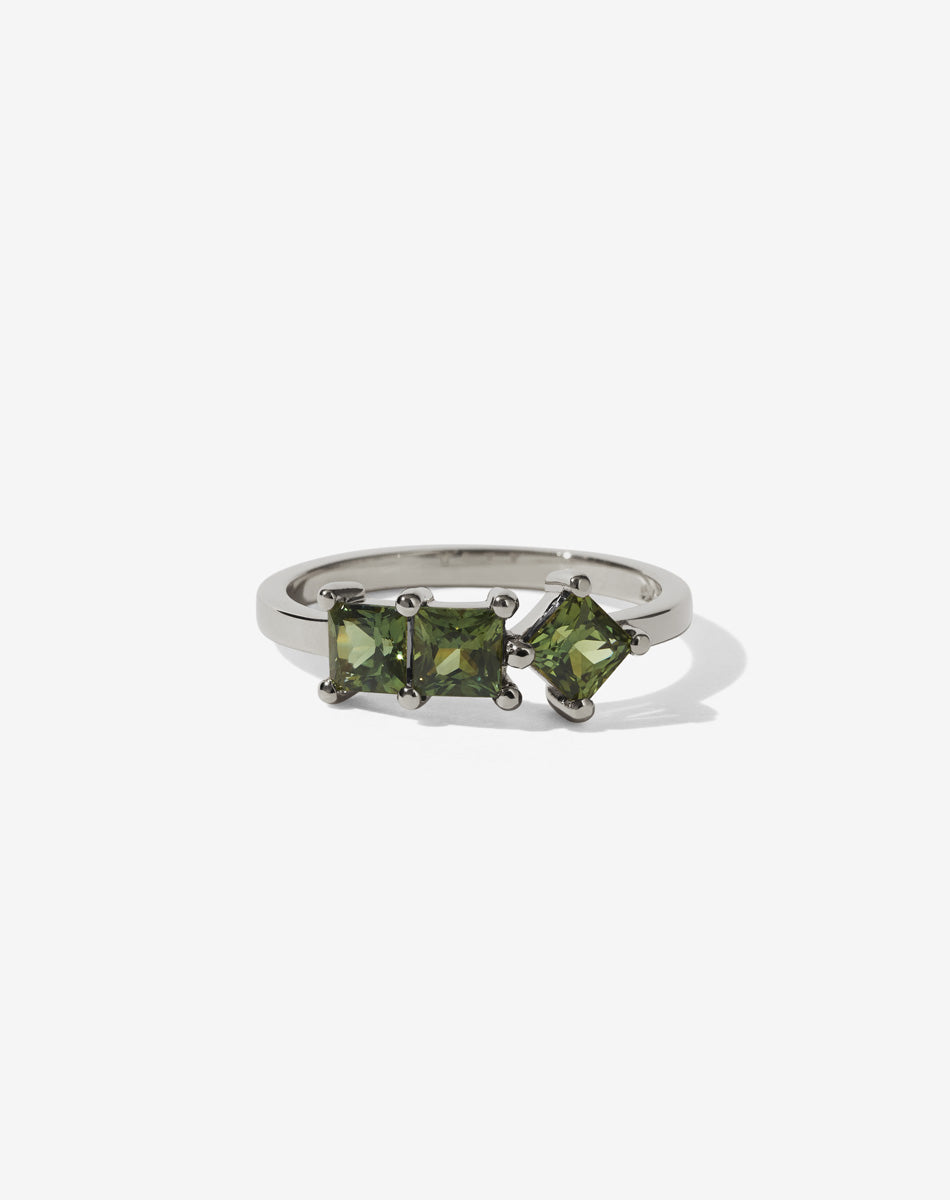 Meadowlark Jewellery’s modern 1.20ct Imogen Engagement Ring in 18ct White Gold, claw set with three princess cut white diamonds. Atop a fine square band. A graphic 3 stone engagement ring, inspired by art and architecture, this Ceremonial design is made to order in New Zealand.
