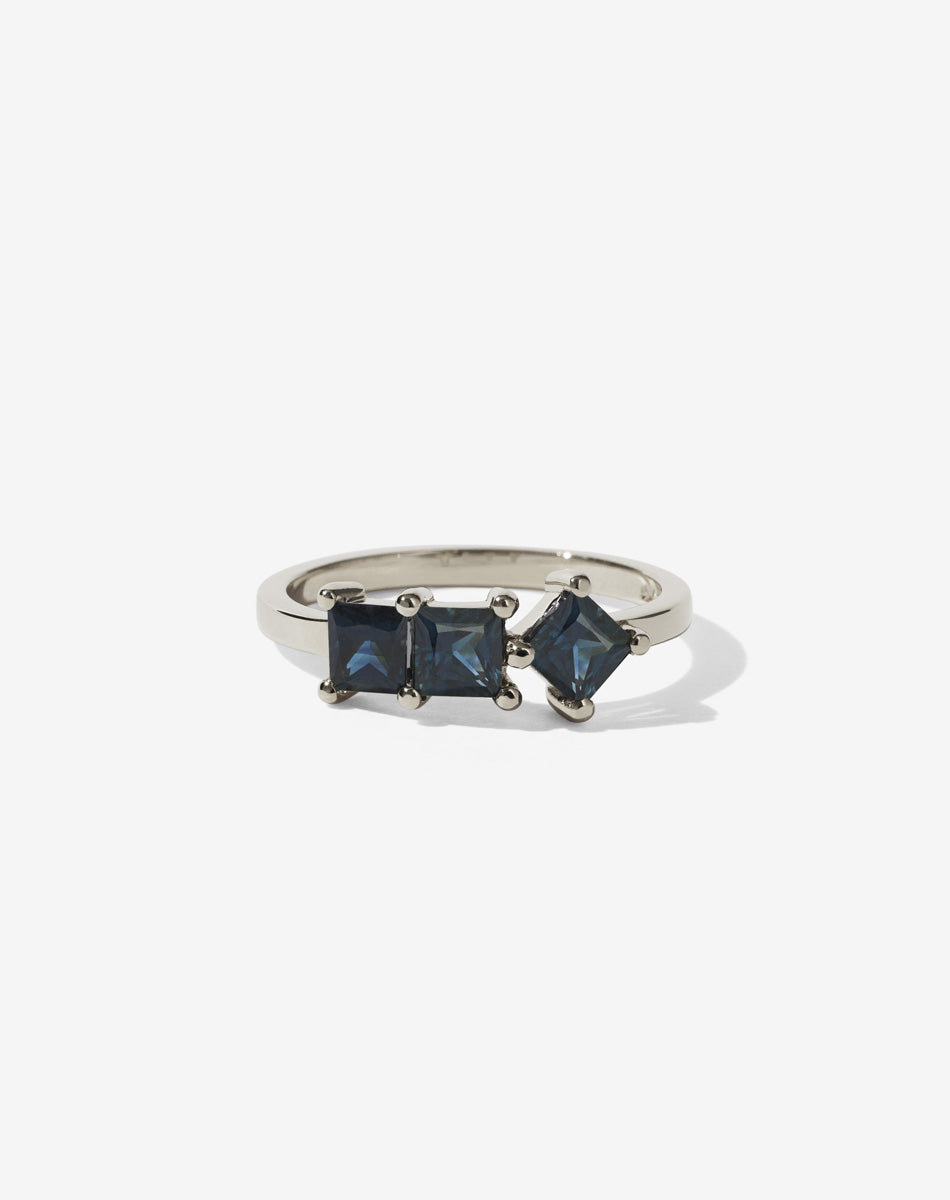 Meadowlark Jewellery’s modern 1.20ct Imogen Engagement Ring in 9ct White Gold, claw set with three princess cut white diamonds. Atop a fine square band. A graphic 3 stone engagement ring, inspired by art and architecture, this Ceremonial design is made to order in New Zealand.