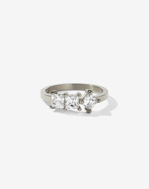 Meadowlark Jewellery’s modern 1.20ct Imogen Engagement Ring in 9ct White Gold, claw set with three princess cut white diamonds. Atop a fine square band. A graphic 3 stone engagement ring, inspired by art and architecture, this Ceremonial design is made to order in New Zealand.