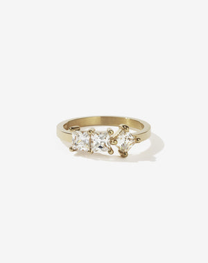 Meadowlark Jewellery’s modern 1.20ct Imogen Engagement Ring in 9ct Yellow Gold, claw set with three princess cut white diamonds. Atop a fine square band. A graphic 3 stone engagement ring, inspired by art and architecture, this Ceremonial design is made to order in New Zealand.