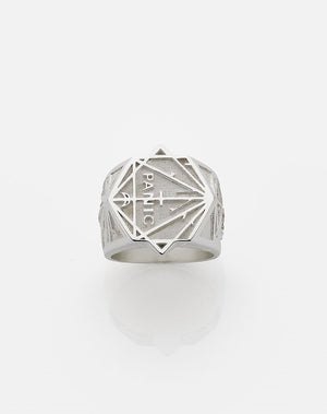 A heavy weighted sterling silver ring with a collage of artworks designed by Andrew McLeod.