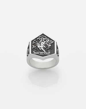 A heavy weighted sterling silver ring with a collage of artworks, designed in collaboration with NZ artist Andrew McLeod.