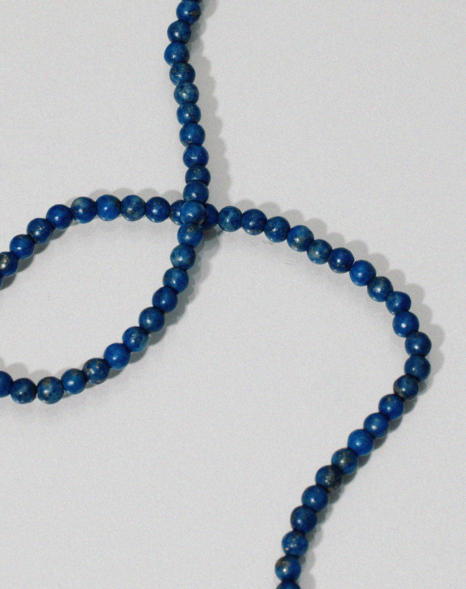Small spherical lapis lazuli stone beads anklet worn by model