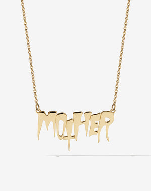 A gold necklace with the word 'MOTHER' as the central pendant, attached to a fine chain. In collaboration with Australian artist Nell