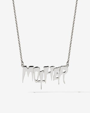 A sterling silver necklace with the word 'MOTHER' as the central pendant, attached to a fine chain. In collaboration with Australian artist Nell