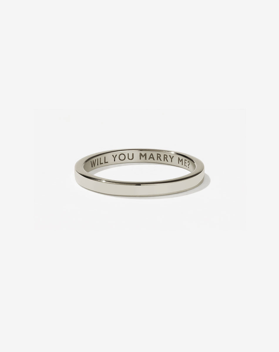 Meadowlark Jewellery’s Stand In Ring in 9ct White Gold, engraved with ‘will you marry me’. A 2mm wide minimalist placeholder or proposal ring. This Ceremonial design can be worn as a wedding band and is made to order in New Zealand.