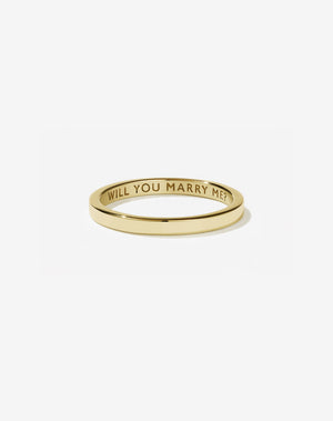Meadowlark Jewellery’s Stand In Ring in 9ct Yellow Gold, engraved with ‘will you marry me’. A 2mm wide minimalist placeholder or proposal ring. This Ceremonial design can be worn as a wedding band and is made to order in New Zealand.