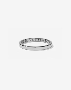 Meadowlark Jewellery’s 0.10ct Stand In Ring in Sterling Silver, engraved with ‘will you marry me’ and swiss set with a round brilliant cut white diamond. A 2mm wide minimalist placeholder or proposal ring. This Ceremonial design can be worn as a wedding band and is made to order in New Zealand.