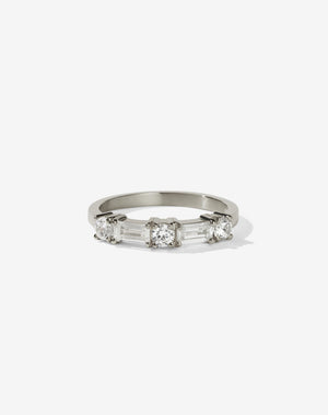 Meadowlark Jewellery’s modern 0.73ct Stella Engagement Ring in 18ct White Gold, claw set with two baguette cut white diamonds and three round brilliant cut white diamonds. Atop a fine square band. A Ceremonial design made to order in New Zealand. Wear as a wedding band with our Hilma Ring or alternative engagement ring.
