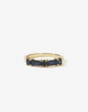 Meadowlark Jewellery’s modern Stella Engagement Ring in 18ct Yellow Gold, claw set with two baguette cut blue sapphires and three round brilliant cut blue sapphires. Atop a fine square band. Fully traceable and ethically sourced blue and green sapphires from Queensland, Australia. A Ceremonial design made to order in New Zealand. Wear as a wedding band with our Hilma Ring or alternative engagement ring.