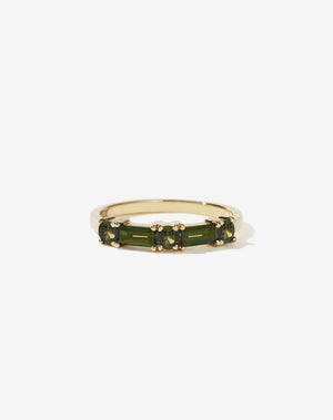Meadowlark Jewellery’s modern Stella Engagement Ring in 18ct Yellow Gold, claw set with two baguette cut green sapphires and three round brilliant cut green sapphires. Atop a fine square band. Fully traceable and ethically sourced blue and green sapphires from Queensland, Australia. A Ceremonial design made to order in New Zealand. Wear as a wedding band with our Hilma Ring or alternative engagement ring.