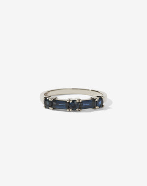 Meadowlark Jewellery’s modern Stella Engagement Ring in 9ct White Gold, claw set with two baguette cut blue sapphires and three round brilliant cut blue sapphires. Atop a fine square band. Fully traceable and ethically sourced blue and green sapphires from Queensland, Australia. A Ceremonial design made to order in New Zealand. Wear as a wedding band with our Hilma Ring or alternative engagement ring.