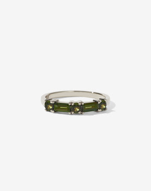 Meadowlark Jewellery’s modern Stella Engagement Ring in 9ct White Gold, claw set with two baguette cut green sapphires and three round brilliant cut green sapphires. Atop a fine square band. Fully traceable and ethically sourced blue and green sapphires from Queensland, Australia. A Ceremonial design made to order in New Zealand. Wear as a wedding band with our Hilma Ring or alternative engagement ring.