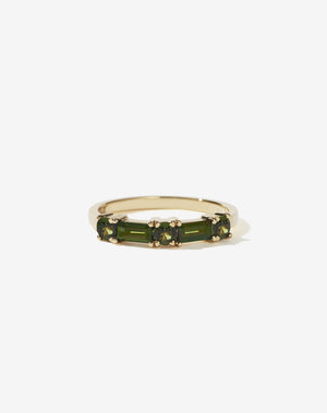 Meadowlark Jewellery’s modern Stella Engagement Ring in 9ct Yellow Gold, claw set with two baguette cut green sapphires and three round brilliant cut green sapphires. Atop a fine square band. Fully traceable and ethically sourced blue and green sapphires from Queensland, Australia. A Ceremonial design made to order in New Zealand. Wear as a wedding band with our Hilma Ring or alternative engagement ring.