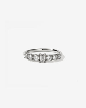 Meadowlark Jewellery’s beautiful Amelie Engagement Ring in Platinum, claw set with 0.70ct emerald cut and round brilliant cut white diamonds atop a fine round band. A low set, petite seven stone engagement ring this Ceremonial design made to order in New Zealand.