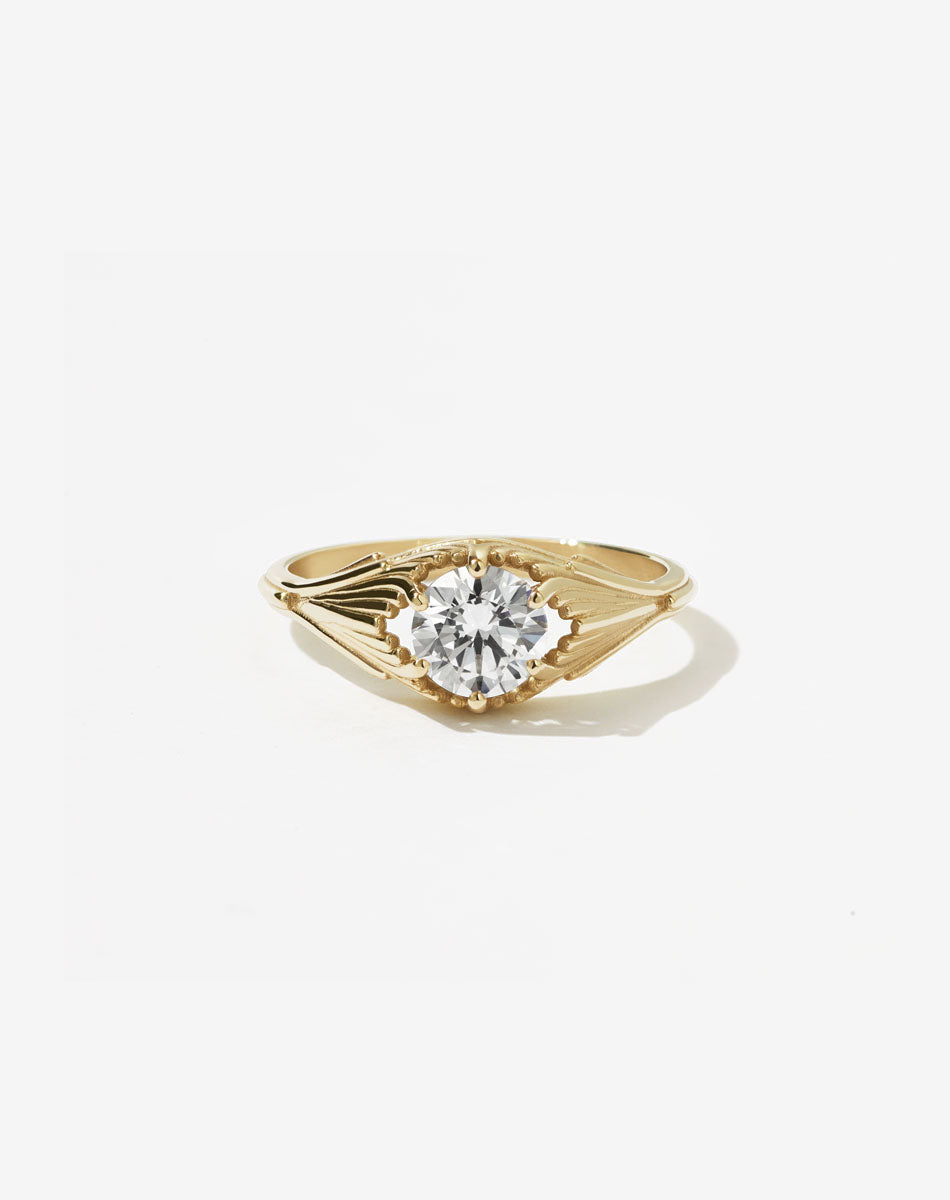 Meadowlark Jewellery’s vintage inspired Aphrodite Engagement Ring in 14ct Yellow Gold, claw set with a 0.84ct round brilliant cut white diamond. An iconic Ceremonial design, made to order in New Zealand. Inspired by our popular Vita Stud Earrings and Carlo Giorgi's iconic 1970's Ginkgo Leaf Lamp. Pair with our diamond pave set Aphrodite Wedding Band.