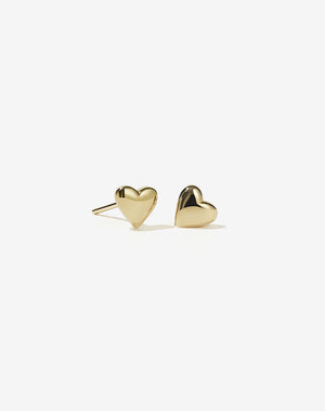 A pair of gold plated stud earrings in the shape of puffy hearts.