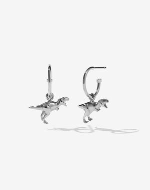 A pair of Sterling Silver hoop earrings with a small gold dino charm attached to them