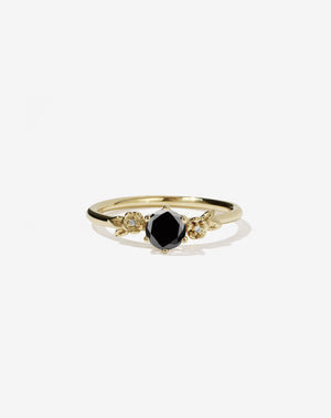 Meadowlark Jewellery’s iconic Alba Engagement Ring in 9ct Yellow Gold, claw set with a round brilliant cut black diamond. Round band adorned with flowers, set with round brilliant cut white diamonds. Pair with our bestseller, the Alba Band Stone Set or Plain. Made in New Zealand.