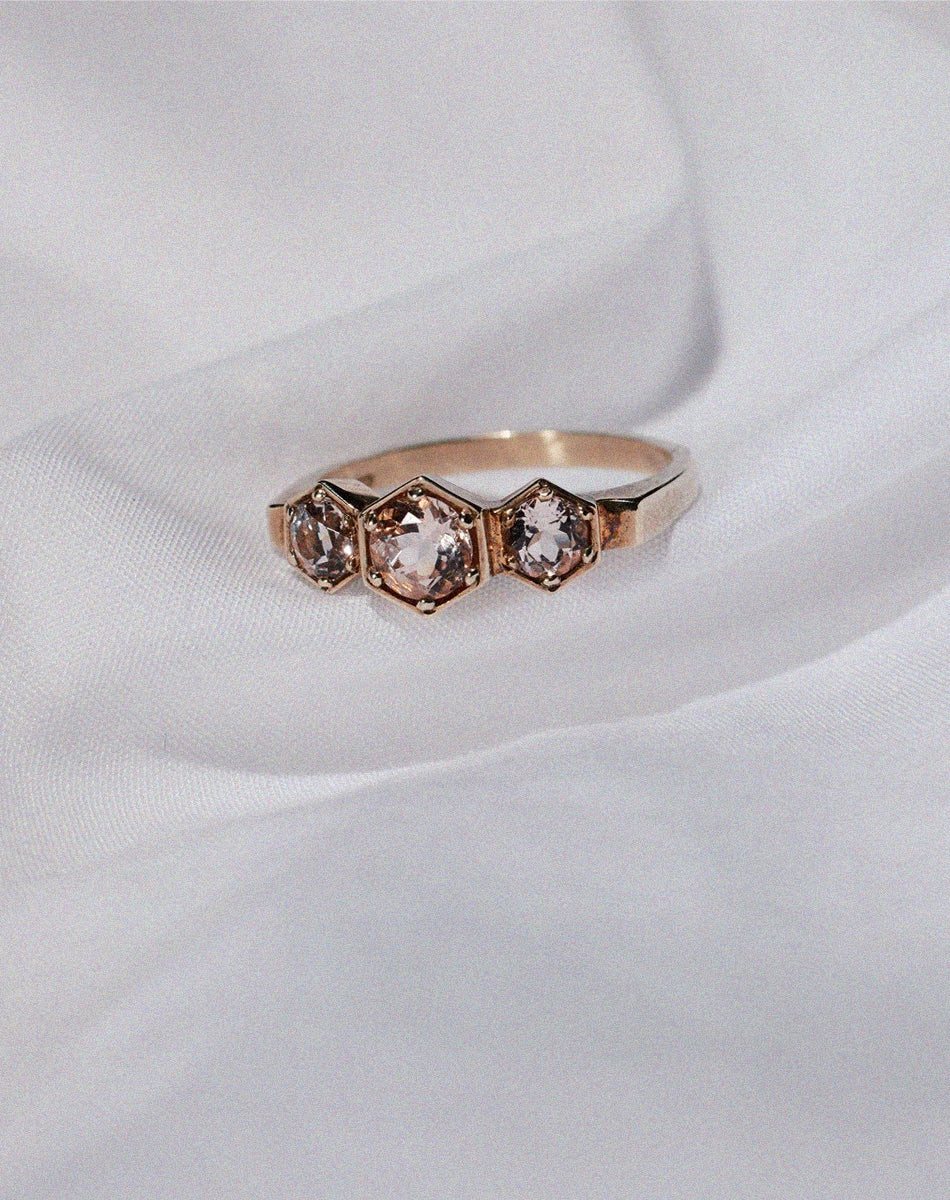 Meadowlark Jewellery’s classic 3 Hexagon Stone Engagement Ring in 9ct Yellow Gold claw set with round brilliant cut morganite. A bold and beloved 3 stone ring, this Ceremonial design is made to order in New Zealand.