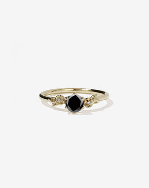 Meadowlark Jewellery’s iconic Alba Engagement Ring in 14ct Yellow Gold, claw set with a round brilliant black white diamond. Round band adorned with flowers, set with round brilliant cut white diamonds. Pair with our bestseller, the Alba Band Stone Set or Plain. Made in New Zealand.