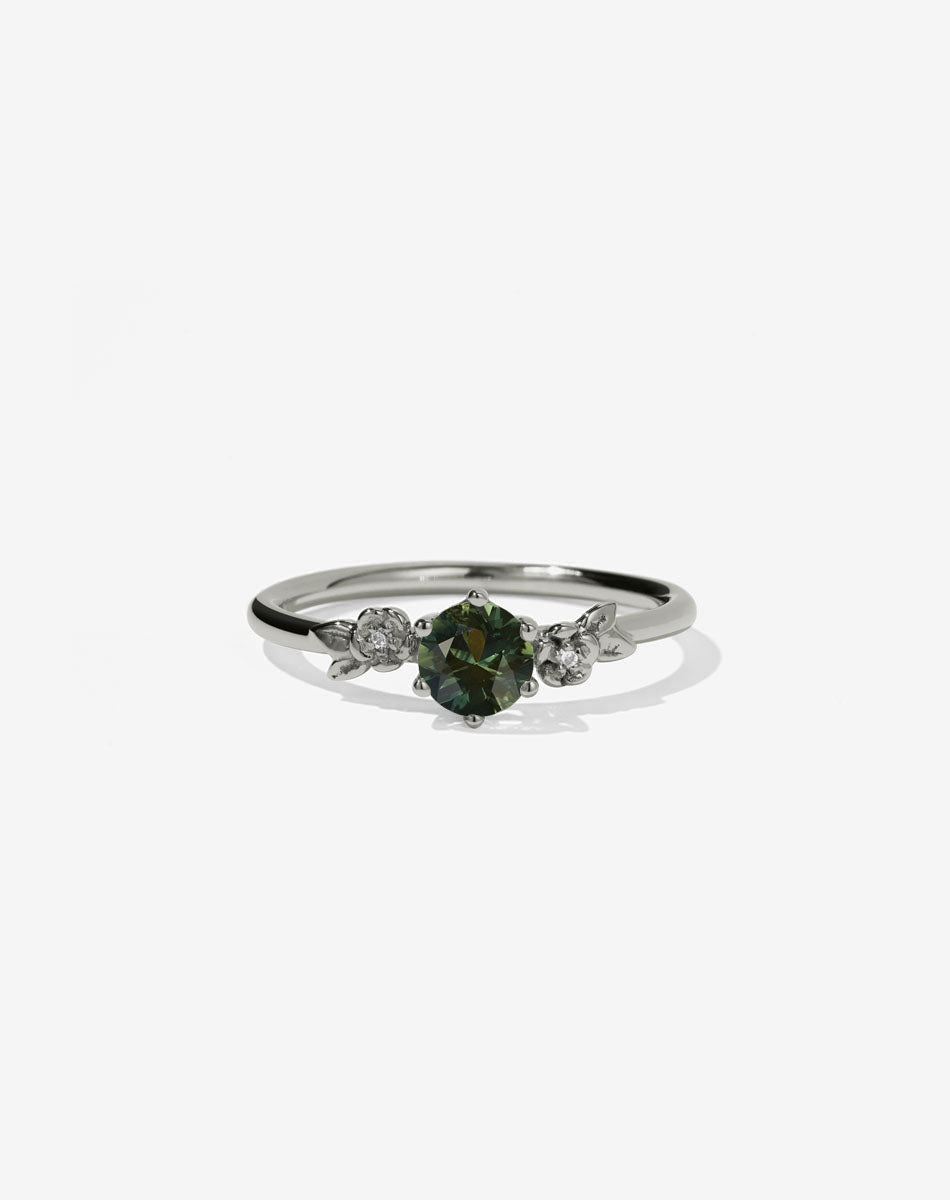 Meadowlark Jewellery’s iconic Alba Engagement Ring in 18ct White Gold, claw set with a 0.50ct round brilliant cut white diamond. Round band adorned with flowers, set with round brilliant cut white diamonds. Pair with our bestseller, the Alba Band Stone Set or Plain. Made in New Zealand.