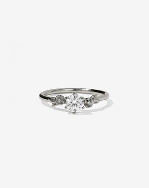 Meadowlark Jewellery’s iconic Alba Engagement Ring in 18ct White Gold, claw set with a 0.50ct round brilliant cut white diamond. Round band adorned with flowers, set with round brilliant cut white diamonds. Pair with our bestseller, the Alba Band Stone Set or Plain. Made in New Zealand.
