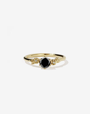 Meadowlark Jewellery’s iconic Alba Engagement Ring in 18ct Yellow Gold, claw set with a round brilliant cut black diamond. Round band adorned with flowers, set with round brilliant cut white diamonds. Pair with our bestseller, the Alba Band Stone Set or Plain. Made in New Zealand.
